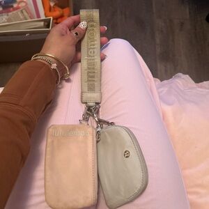 Pink and grayish/cream lulu dual wrist pouch
